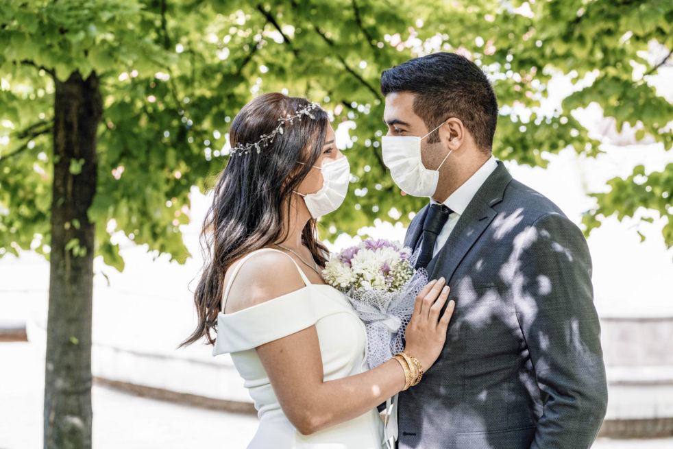 Precautions that could keep wedding guests safe during the pandemic - Couples planning to tie the knot in the months ahead can still do so, but the WHO recommends they take certain precautions as they organize their ceremonies and receptions. (Bride and Groom wearing a face mask) Image Compliments of MetroCreative.