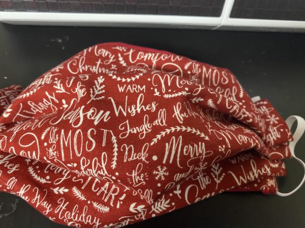 Red Christmas Sayings Face Mask - This Christmas Face mask has a lot of different types of Christmas sayings. #Christmas