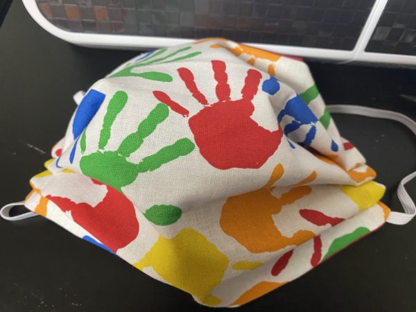 Colorful Handprint Face Mask this face mask has handprints on it in various colors. #Handprint