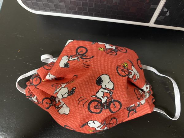 Snoopy & Woodstock On A Bicycle Face Mask - A Face Mask with Snoopy and Woodstock on bikes. #Snoopy #Woodstock