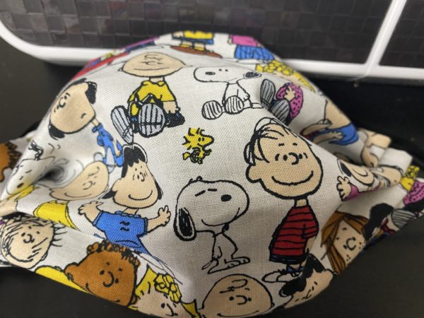 Snoopy and the Peanuts Gang Face Mask a great face mask with a good bit of the Peanuts gang. #Peanuts #Snoopy #CharlieBrown