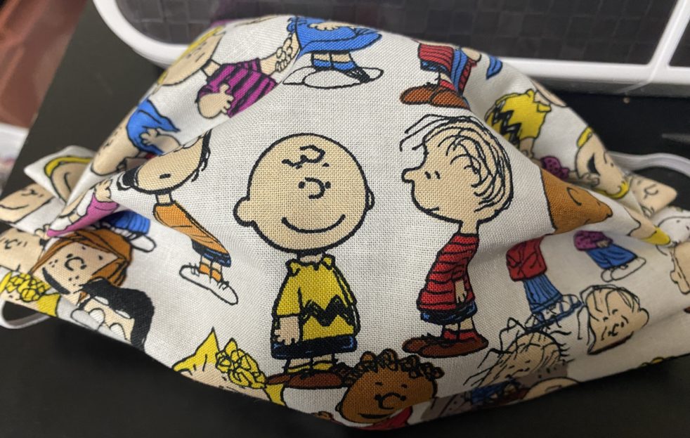 Snoopy and the Peanuts Gang Face Mask a great face mask with a good bit of the Peanuts gang. #Peanuts #Snoopy #CharlieBrown