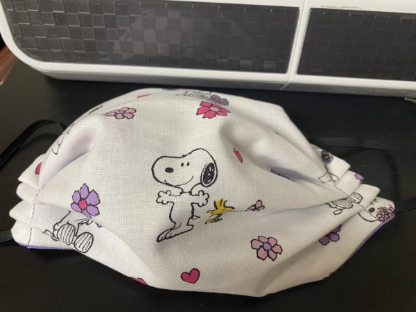 Spring Snoopy Face Mask - A Spring themed face mask with Snoopy and Woodstock with flowers and hearts.
