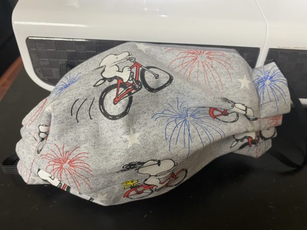 Snoopy & Woodstock on a Bicycle with Fireworks Face Mask - A 4th of July Patriotic Face Mask with Snoopy and Woodstock on it. #Snoopy #Woodstock