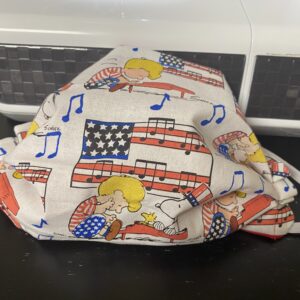 Schroeder, Snoopy and Woodstock Patriotic Face Mask - A patriotic-themed face mask with an American Flag, Piano, Schroeder, Snoopy and Woodstock on it. #Snoopy #Woodstock #Schroeder