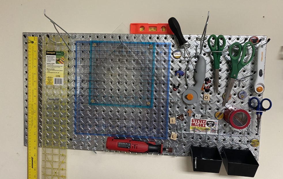 How to hang a Sewing Pegboard - DIY video and instructions on how to install a pegboard to hold your sewing equipment and tools. #pegboard