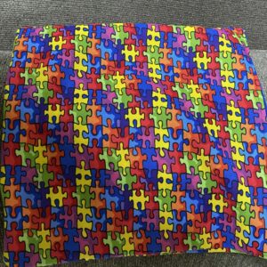 Autism Awareness Decorative Pillow - A decorative pillow with colorful puzzle pieces on it. #Autism #AutismPillow #AutismAwareness