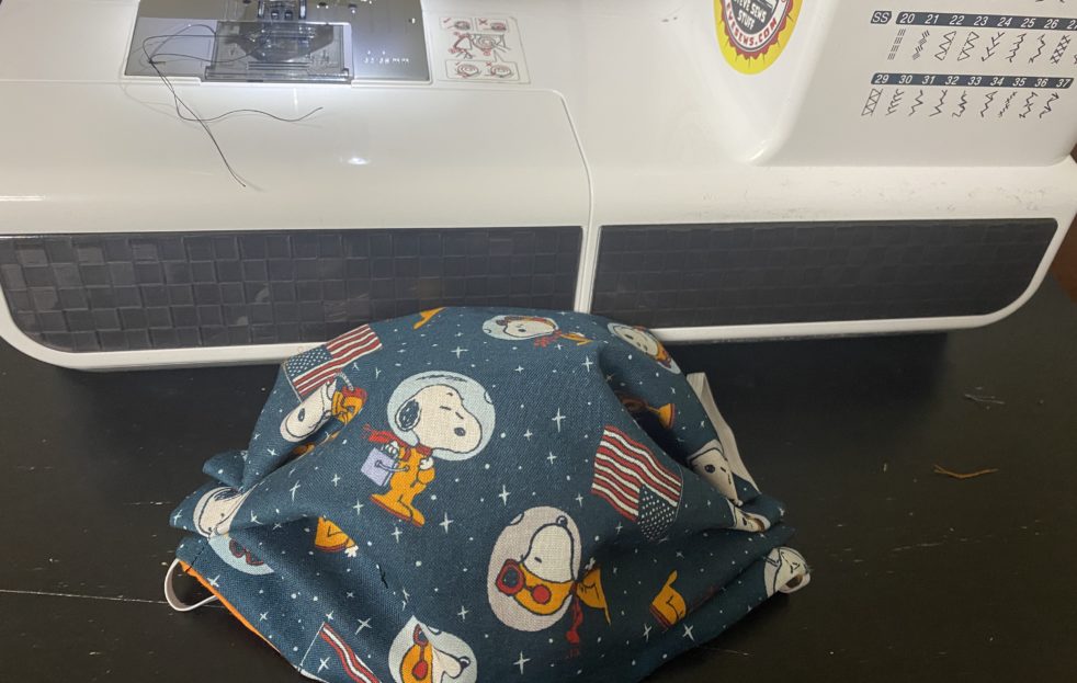 Snoopy in Space Face Mask - This face mask features Snoopy as an Astronaut and in space. #Snoopy #SnoopyinSpace #SnoopyFaceMask