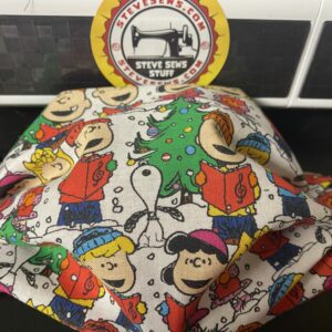 A Charlie Brown Christmas Face Mask - this face mask features Charlie Brown, Snoopy, and the gang singing a Christmas Carol. #Christmas #Snoopy #CharlieBrown #CharlieBrownChristmas #Snoopy