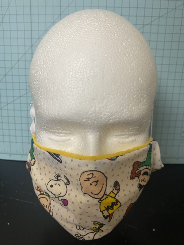Peanuts Easter Face Mask - An Easter-themed face mask with the Peanuts gang. #Snoopy #Easter #CharlieBrown #Woodstock and more!