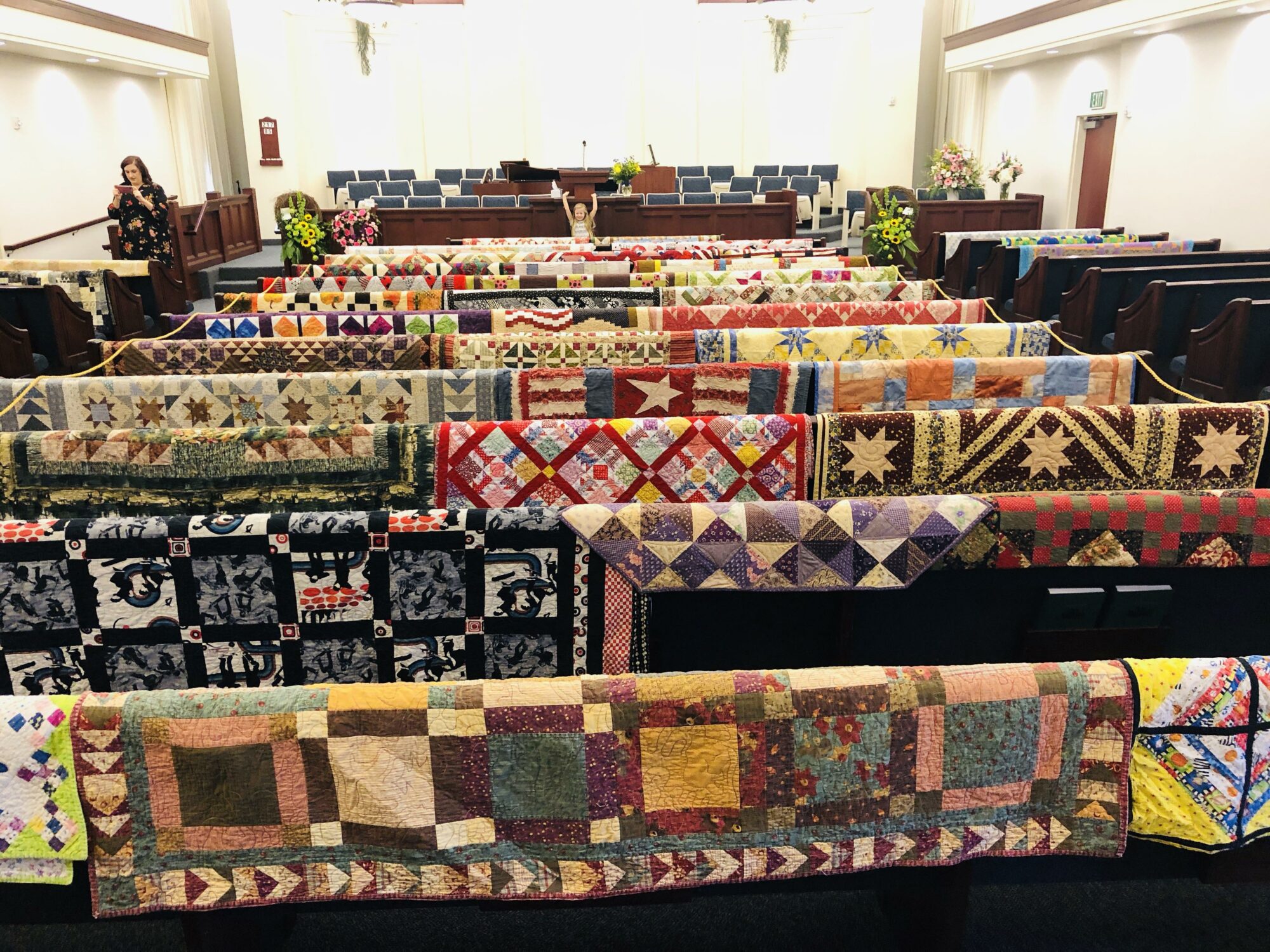 Unknown date and person - maybe 2019.  Quilts on Display at Funerals - What a great way to show off all the quilts a loved one made when they pass away. #quilts #quilting 