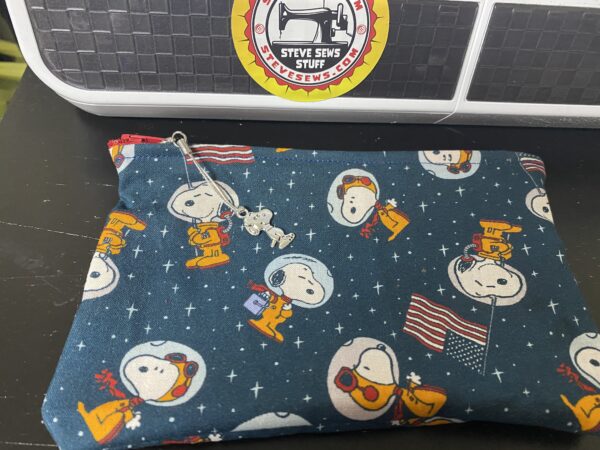 Snoopy in Space Zipper Pouch - This Zipper Pouch features the famous beagle, Snoopy in Space, the Astronaut Snoopy. With a Snoopy Zipper Pull. #Snoopy #SnoopyInSpace #AstronautSnoopy #Astronaut #Snoopy