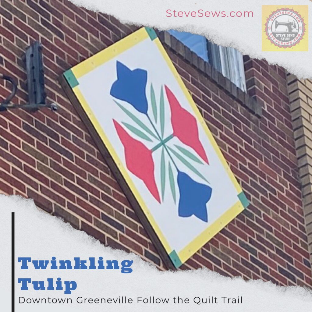 Twinkling Tulip - a quilt block on the Downtown Greeneville Follow the Quilt Trail. #QuiltTrail #GreenevilleTN #TwinklingTulip #Tulip #QuiltBlock #QuitBarn
