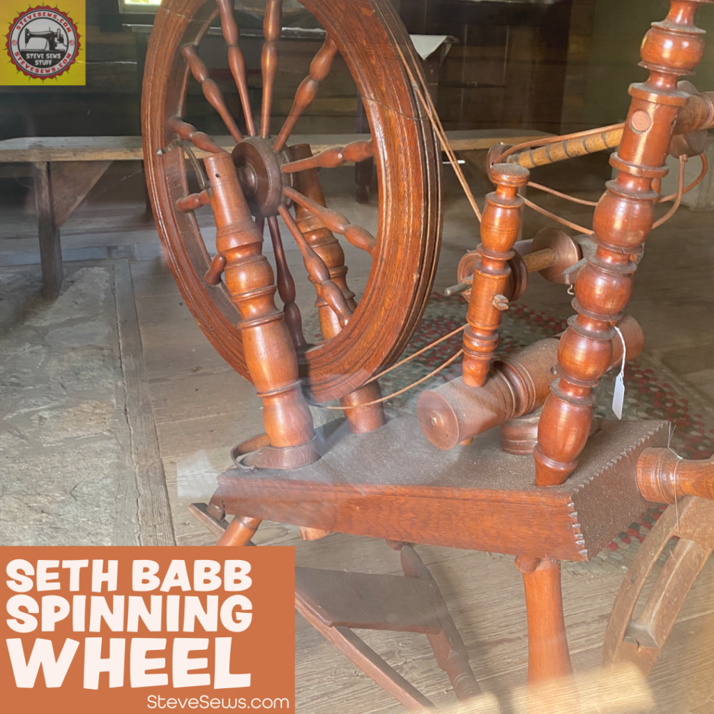 Seth Babb Spinning Wheel - Directly to the left is a Saxony spinning wheel from the Babb family. It was common for wives to spin their own thread and yarn, using the treadle to turn the wheel and gather the linen or flax from the operator's lap or on the tall post and winding the thread or yarn onto the smaller spindle below the big wheel. #spinningwheel #babb 