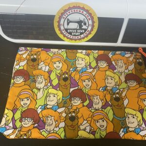 Scooby-Doo & Gang Zipper Pouch - this face mask features the gang from Scooby-Doo on it and it is colorful. #Scooby #ScoobyDoo #ZipperPouch