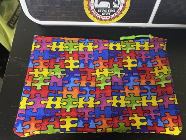 Autism Awareness Zipper Pouch - A puzzle-themed zipper pouch that is for Autism Awareness. #Autism #AutismSpeaks #AutismAwareness