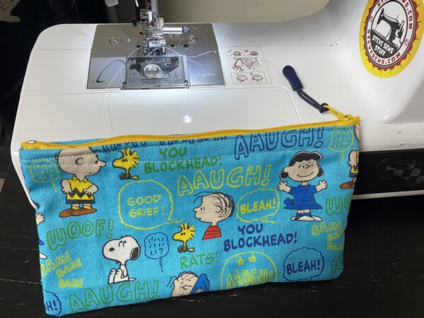 Peanut Gang with Sayings Zipper Pouch – this face mask has some of the Peanuts Gang and sayings on it. #Snoopy #CharlieBrown