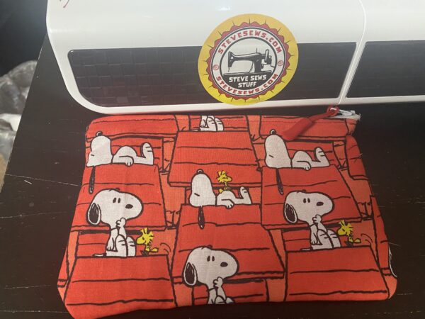 Snoopy and Doghouse Zipper Pouch - this zipper pouch has Snoopy and his doghouse on it. #Snoopy #Doghouse #ZipperPouch