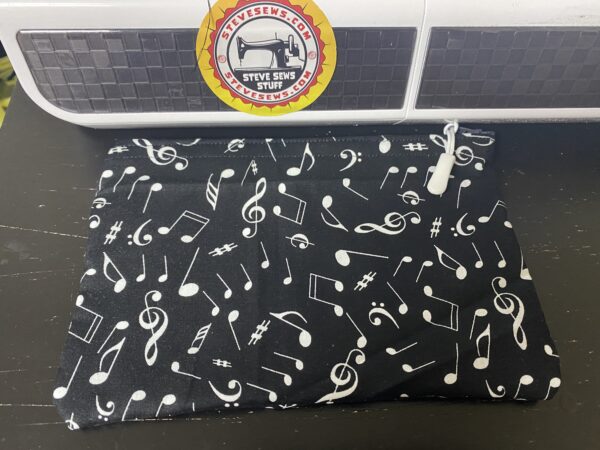 Music Note Zipper Pouch - A Black and white zipper pouch with all kinds of music notes on it. #Music #Band #Choir #MusicNotes