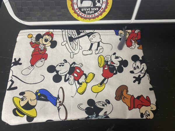 Mickey through the Years Zipper Pouch - this zipper pouch has Mickey Mouse from various years on it. #Mickey #MickeyMouse