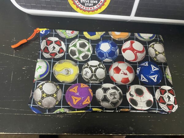 Soccer Zipper Pouch this zipper pouch has game plays and soccer balls on it. Great for anyone who loves soccer. #soccer