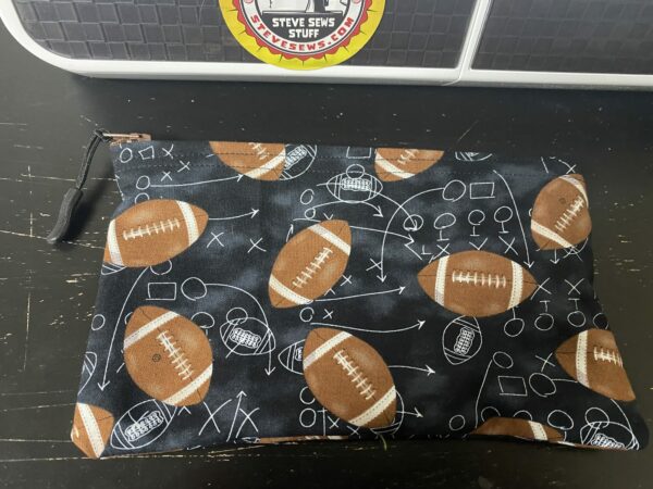 Football Zipper Pouch this zipper pouch has game plays and footballs on it. Great for anyone who loves football. #Football #GamePlay