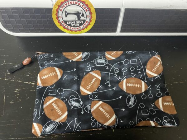 Football Zipper Pouch this zipper pouch has game plays and footballs on it. Great for anyone who loves football. #Football #GamePlay