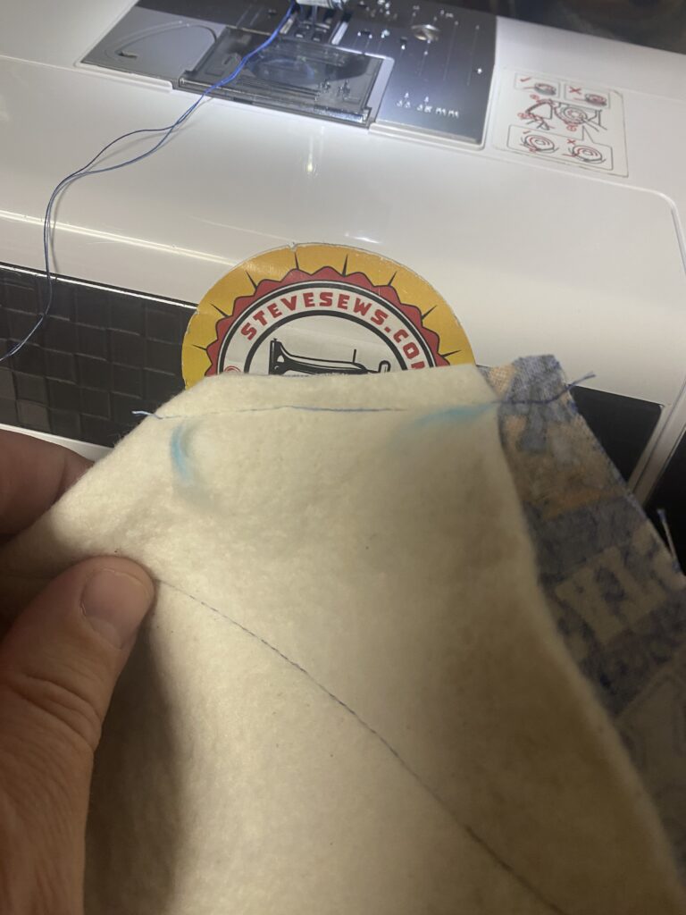 8. Sew from the 2 inch mark to the 1 inch mark on both sides. 

9. Cut the corners off. Make sure to cut on the other side of the seam. 