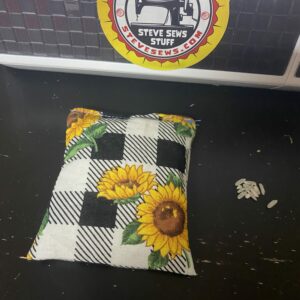 Sunflower Rice Hand Warmer is a set of two rice hand warmers with sunflowers on them with a black and white plaid look to them. #Sunflowers