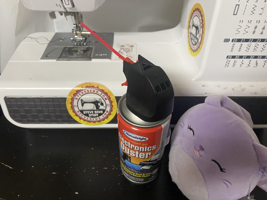 Meet Bubbles, a Squishmallow, she is our Equipment Sterilization Specialist. She has a can of air to clean out the sewing machine’s bobbin dock. 