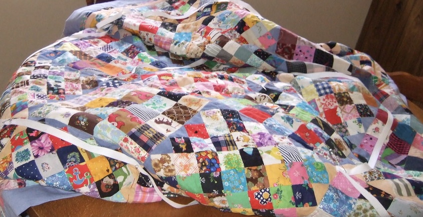 Quilters create a charity quilt - Write a story about a group of quilters who come together to create a special quilt to auction off for charity, each person contributing their own unique square to the final product.