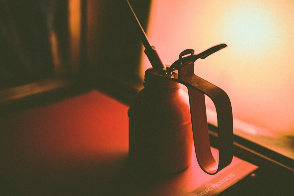 Why Oil Your Sewing Machine? Sewing machines are an essential tool for anyone who loves to sew. #sewingmachine

selective focus photography of oil can