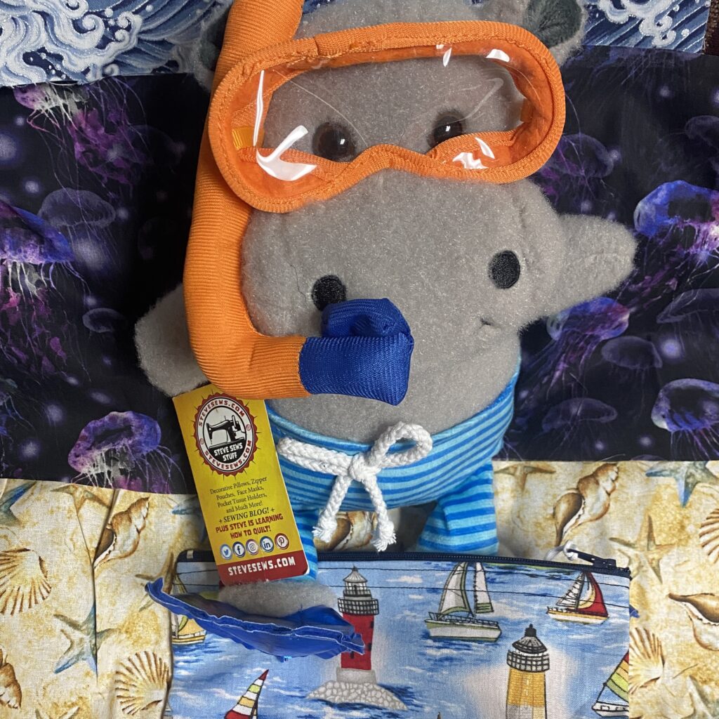Meet Tanker the Hippo he loves under sea adventures and scuba diving. #hippo #scubadive #scubadiving #hippos #underthesea he will serve as our Service Technician. He is showing off a lighthouse zipper pouch. #nautical #lighthouse 