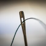 brown wooden clothes pin on white surface