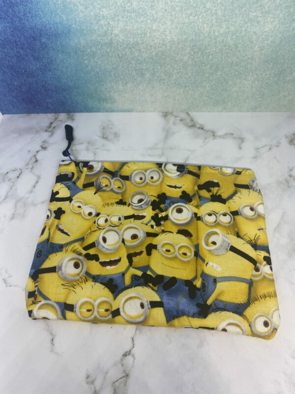 Minions Zipper Pouch - A yellowish zipper pouch with the Minions on it. #Minions