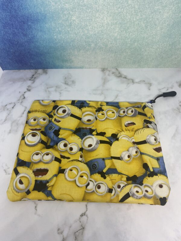 Minions Zipper Pouch - A yellowish zipper pouch with the Minions on it. #Minions