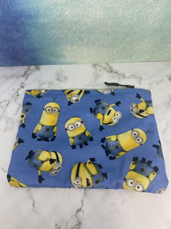 A Medium blue zipper pouch with the Minions on it. #Minions
