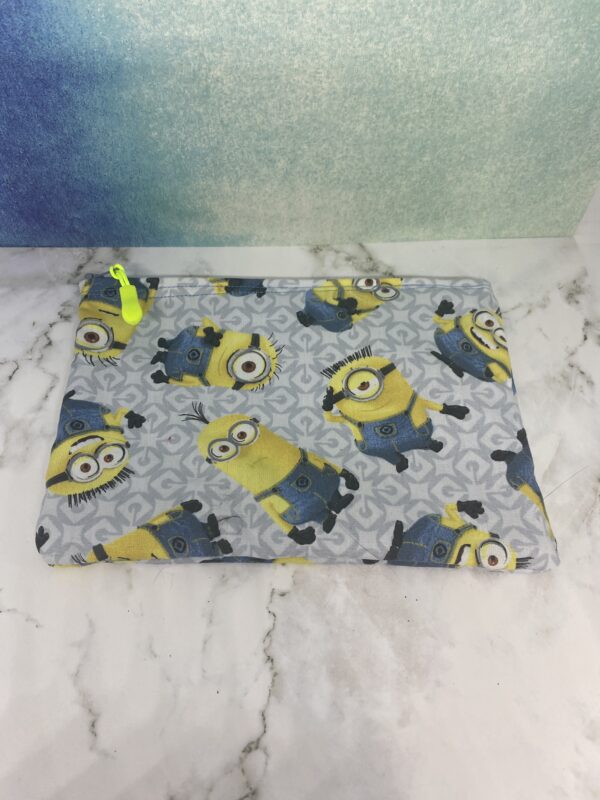 Minions Zipper Pouch - A gray zipper pouch with the Minions on it. #Minions