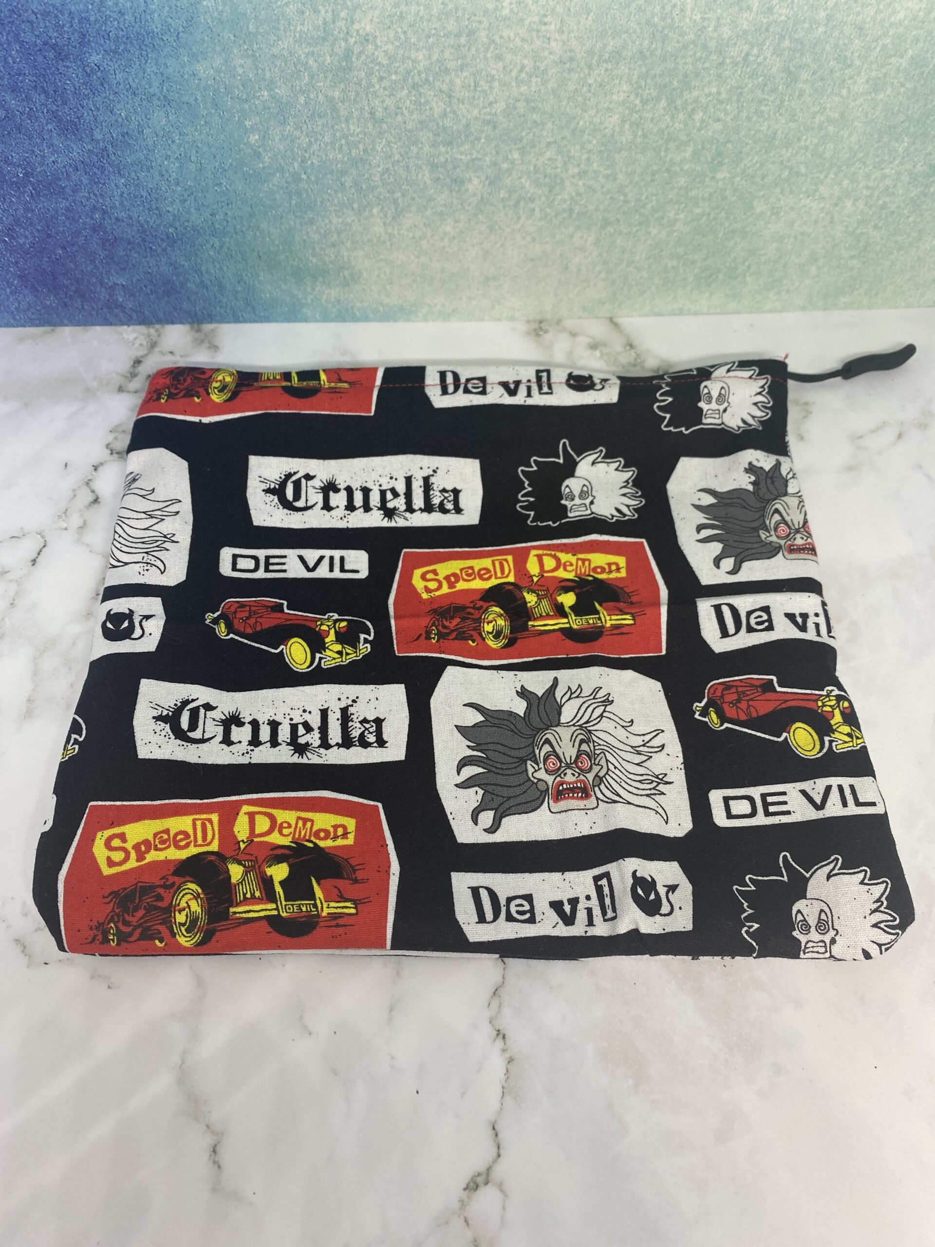 Cruella Zipper Pouch is a zipper pouch with Curella de Vil on it. #Cruella #CruelladeVil