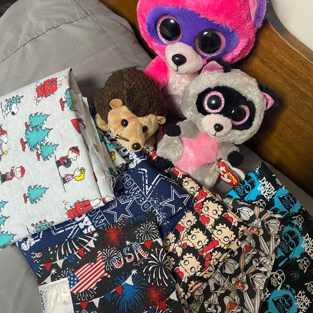 Meet Prickles, Roxie, & Rocco - Prickles (The Hedgehog- is a Rare Ty Beanie Baby with 3 Errors on his tags) and Roxie (Big Pink Raccoon) and Rocco (Small Gray Raccoon). Both the Raccoons are Ty Beanie Boos. All three of these Lovees will help in fabric trends and shopping I for trending fabric. Just like these scores they came back with. Ironically the raccoons were adopted the day before raccoon appreciation day. 